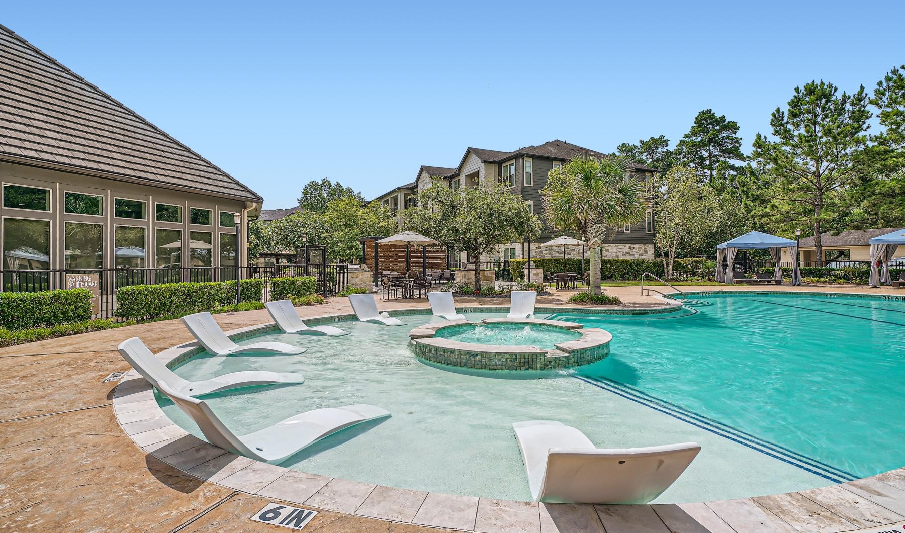 a pool with chairs around it