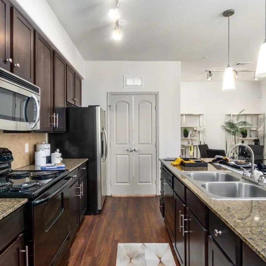 a kitchen with black appliances